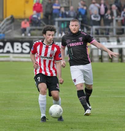 Derry City's Barry McNamee, pictured with Paul Murphy of Wexford Youth, scored the third goal as the Candystripes marched into the semi-finals of the FAI Cup.