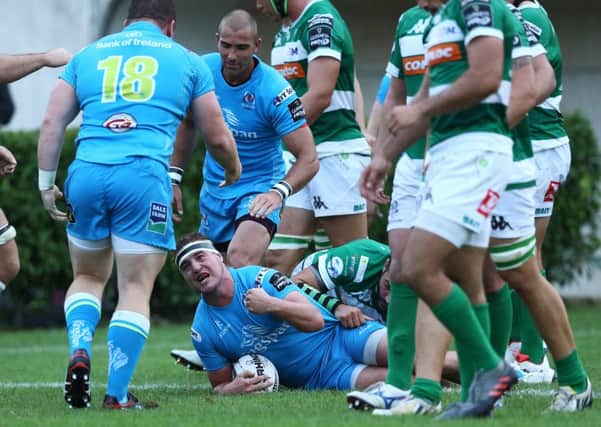 Rob Herring celebrates after scoring a try against Treviso