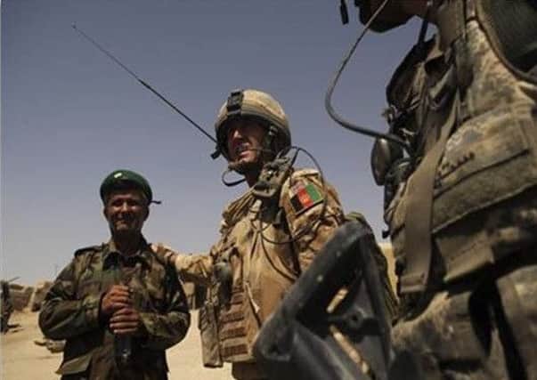 Captain Doug Beattie with an Afghan commander in Afghanistan (not Major Sher-Wali referred to in the story)