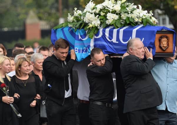 Family and friends at the funeral of Gerard McMahon at St Matthew's Church in Belfast on Thursday