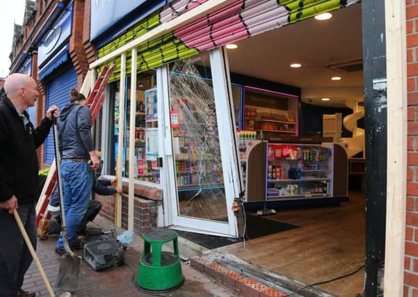 The scene at MacKenzie's Pharmacy on the Falls road in west Belfast where a stolen car lost control and went through a shops shutters early this morning. 

Photo by Kevin Scott / Presseye