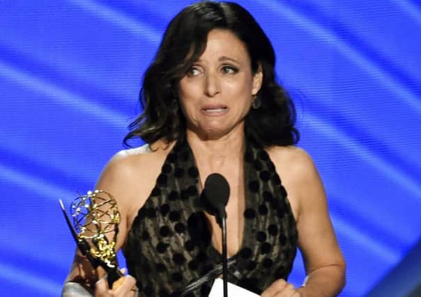 Julia Louis-Dreyfus accepts the award for outstanding lead actress in a comedy series for Veep at the Emmys (AP)