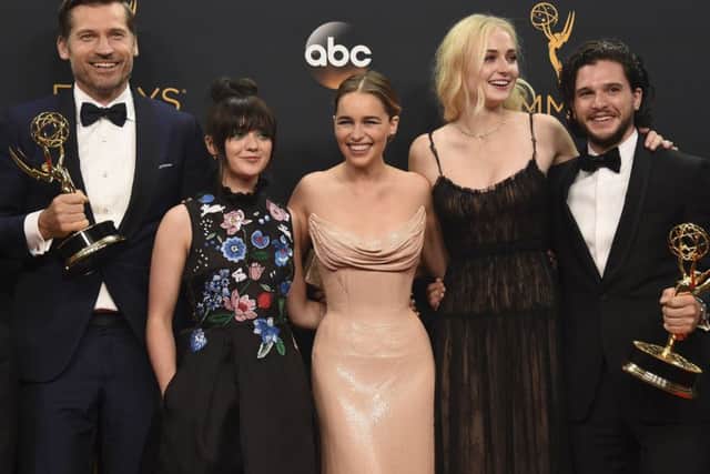 Nikolaj Coster-Waldau, Maisie Williams, Emilia Clarke, Sophie Turner and Kit Harington with the awards won by Game Of Thrones at the Emmys (AP)