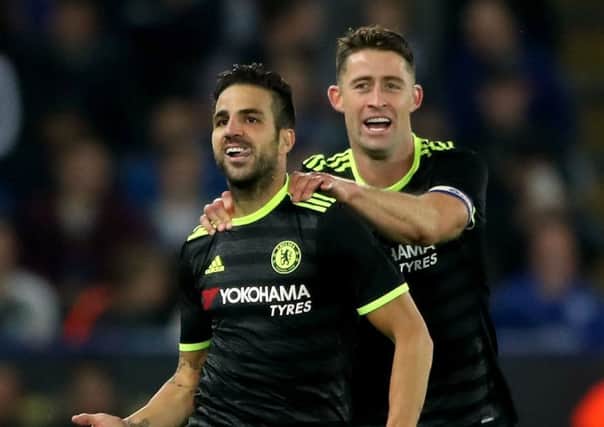 Chelsea's Cesc Fabregas (left)  celebrates scoring his side's fourth goal with team-mate  Gary Cahill