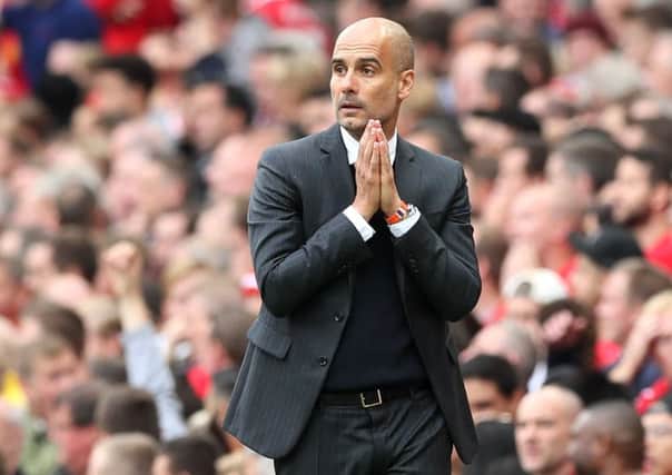 Pep Guardiola is in the midst of a war of words with Yaya Toure's agent. Pic: Martin Rickett/PA Wire.