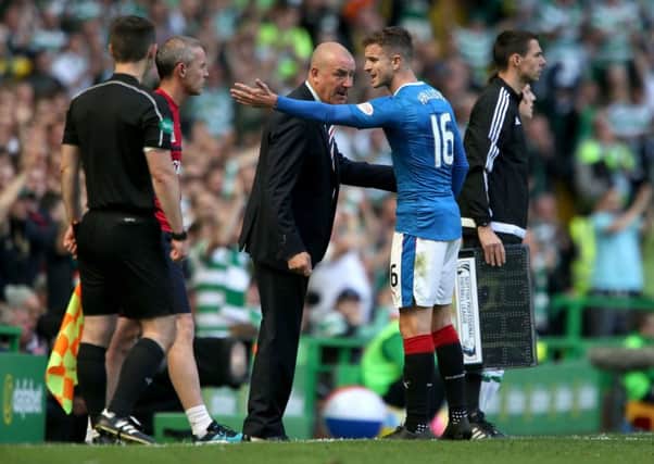 Rangers manager Mark Warburton talks to Andy Halliday during the 5-1 hammering by Celtic