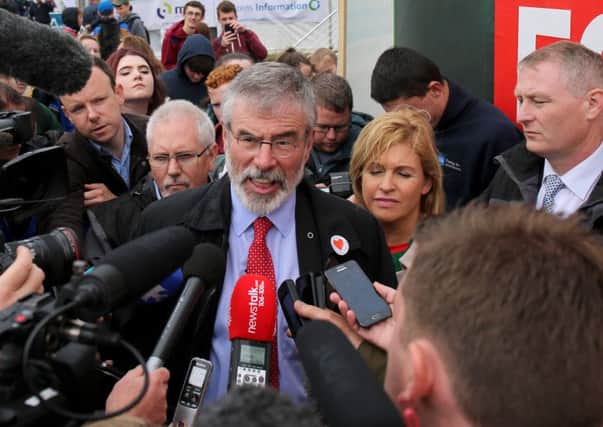 Sinn Fein president Gerry Adams speaks to the media at the National Ploughing Championships in Screggan near Tullamore, after he denied sanctioning the murder of a British spy in the IRA. PRESS ASSOCIATION Photo.