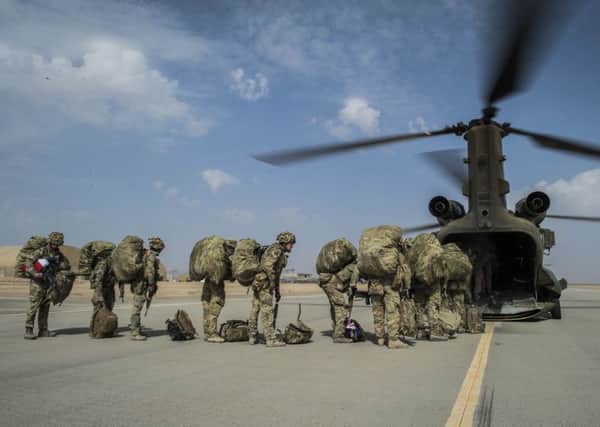 British troops boarding a Chinook helicopter as UK and Coalition forces completed their tactical withdrawal from Afghanistan. Photo: Ben Birchall/PA Wire