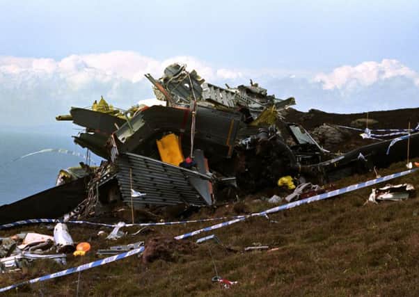 File photo dated 04/06/94 of the wreckage of the Chinook helicopter which crashed on the Mull of Kintyre killing all 29 on board, including 25 top Northern Ireland security experts. PRESS ASSOCIATION Photo. Issue date: Monday January 4, 2010. New evidence has emerged that faulty computer software could have led the Chinook to crash. See PA story DEFENCE Chinook. Photo credit should read: Chris Bacon/PA Wire