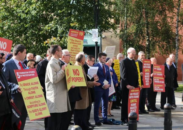 Free Presbyterians protest at the appointment and installation of Fr Edward O Donnell a serving Roman Catholic priest as an ecumenical canon in St Annes Cathedral.