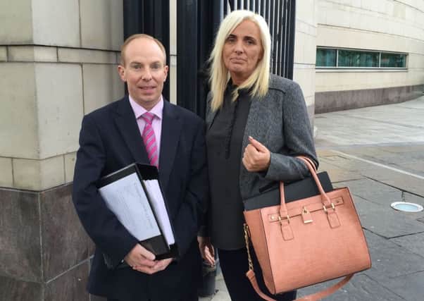 Tracey Carnahan and solicitor Aiden Carlin outside Belfast Coroner's Court where an inquest for tragic young chef Sean Paul Carnahan has opened. Photograph by Lesley-Anne McKeown, PA