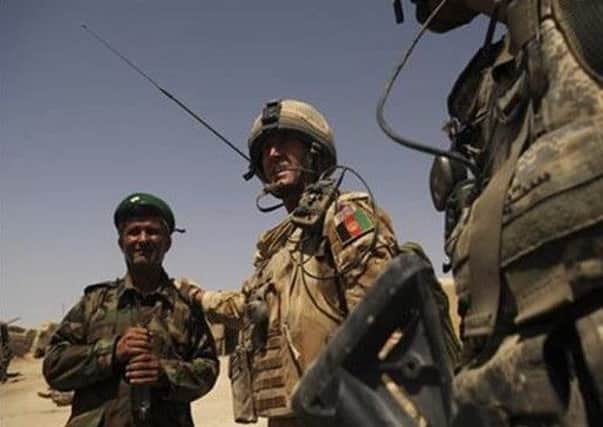 Captain Doug Beattie, pictured with an Afghan commander in Afghanistan