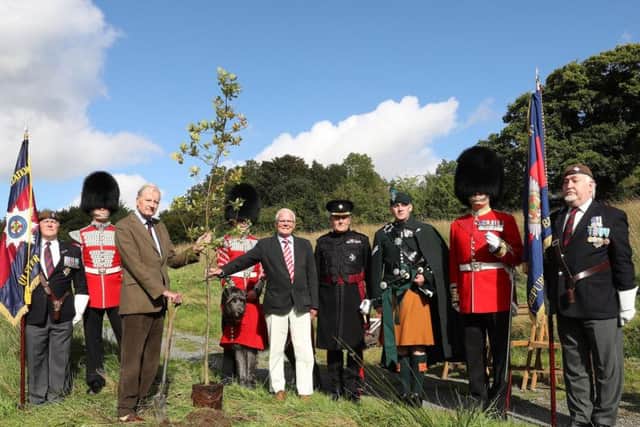Standard Bearer, Mr Norman Wallace, Northern Ireland Branch of the Irish Guards Regimental Association, Drummer Adrian Cathcart, His Grace The Duke of Abercorn KG, former Colonel of the Irish Guards, Dog Handler and the Irish Wolfhound Mascot, Domhnall, Patrick Cregg, Director of the Woodland Trust, Colonel Tim Purdon OBE, Regimental Adjutant Irish Guards, Piper Lance Corporal Richie Spence, RQMS John Gavin, Standard Bearer, Mr Emmet Bourke, Republic of Ireland  Branch of the Regimental Association