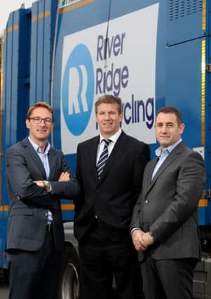 RiverRidge Recycling MD Brett Ross, right, with Paddy Graham from BGF, left and Dale Guest, director of corporate banking at Bank of Ireland NI at the firms Belfast depot