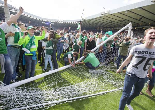 Hibernian fans invade the pitch after the William Hill Scottish Cup Final