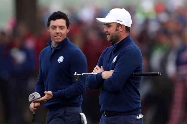 Europe's Rory McIlroy and Andy Sullivan during day one of the 41st Ryder Cup at Hazeltine