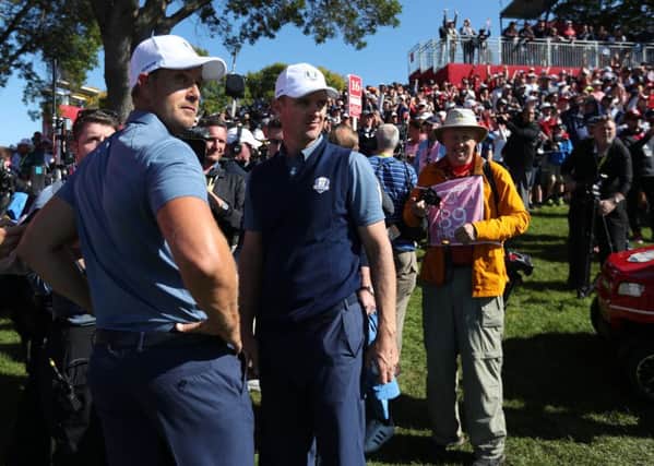 Europe's Henrik Stenson and Europe's Justin Rose after their defeat