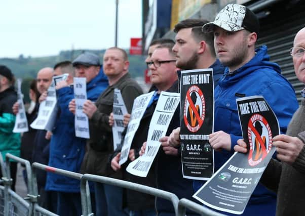 Picture - Kevin Scott / Presseye

members of GARC protest at the return parade makes its way past the Ardoyne shopfront towards the finishing point on October 1st 2016 , Northern Ireland (Photo by Kevin Scott / Presseye)
