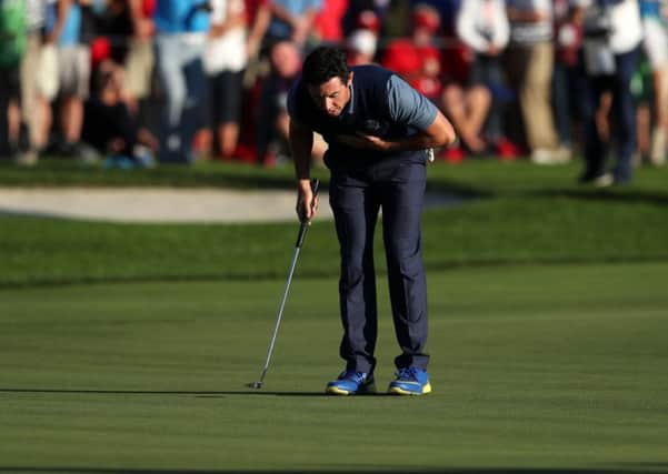 Europe's Rory McIlroy celebrates his putt to win his round during the Fourball's on day one of the 41st Ryder Cup