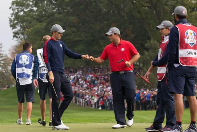 Jordan Spieth and Patrick Reed, pictured, secured a 3&2 victory over Justin Rose and Henrik Stenson
