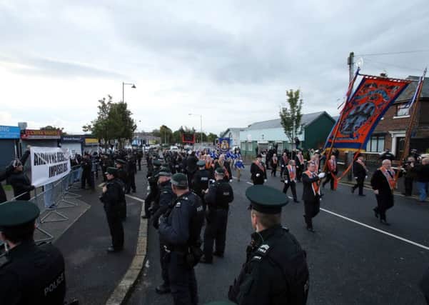 Members of the Greater Ardoyne Residents' Collective mounted a protest during the march, chanting 'walk of shame'