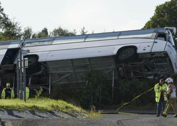 The scene of an accident on the A76 at the Crossroads roundabout near to Bowhouse Prison, Ayrshire where a bus  landed on its side on a grass verge.  PRESS ASSOCIATION Photo. Issue date: Saturday October 1, 2016. Police said the accident is serious but cannot currently confirm the extent of the injuries sustained. See PA story SCOTLAND Bus. Photo credit should read: John Linton/PA Wire