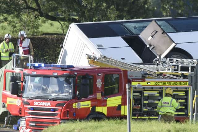 The scene of an accident on the A76 at the Crossroads roundabout near to Bowhouse Prison, Ayrshire where a bus  landed on its side on a grass verge.  PRESS ASSOCIATION Photo. Issue date: Saturday October 1, 2016. Police said the accident is serious but cannot currently confirm the extent of the injuries sustained. See PA story SCOTLAND Bus. Photo credit should read: John Linton/PA Wire