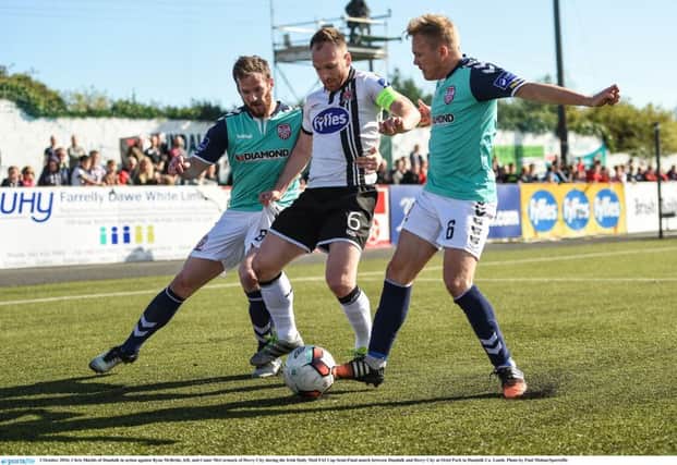 Chris Shields of Dundalk in action against returning Derry City skipper, Ryan McBride, left, and Conor McCormack during the Irish Daily Mail FAI Cup Semi-Final match at Oriel Park in Dundalk Co. Louth. Photo by Paul Mohan/Sportsfile