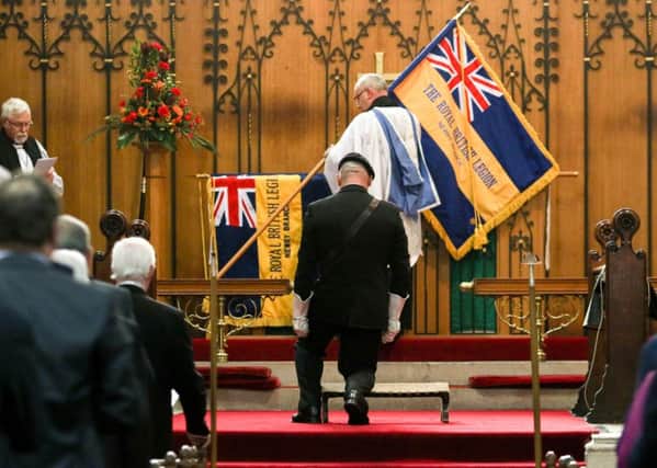 The Newry Branch of the Royal British Legion dedicate a new standard in St. Mary's Church, Newry.  Pictured: The new standard is dedicated.  Credit: Philip Magowan Picture: Philip Magowan