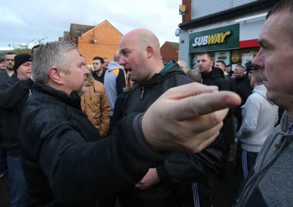 Father Gary Donegan is confronted by hardline republican figure Dee Fennell.