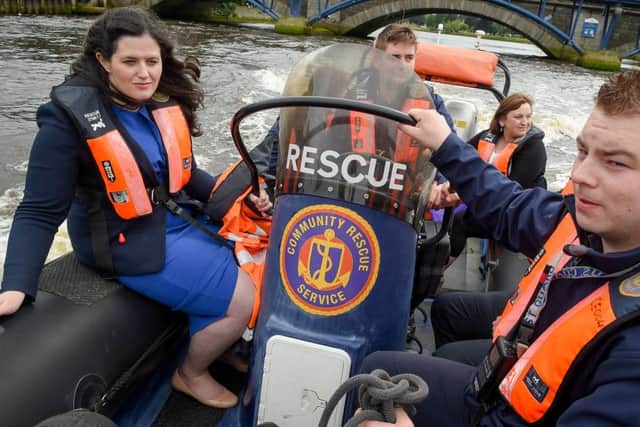 Minister for Justice Claire Sugden pictured with Scott Warke and Jamie Thornton, members of the Community Rescue Service, in Coleraine Marina