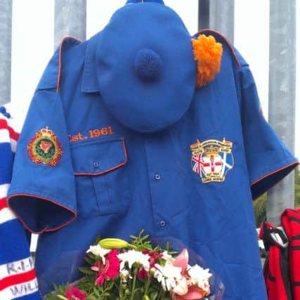 Ryan Baird's uniform from Cairncastle Flute Band, which has been hung in tribute on the railings outside Larne Rangers Supporters Club. INLT-40-719-con