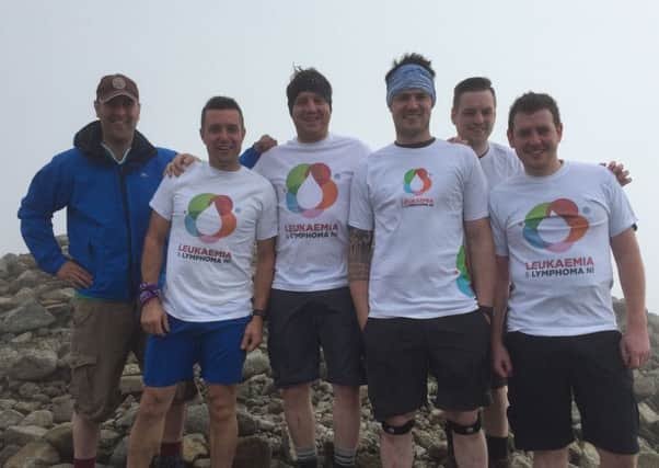 Barry Williamson (third from left) pictured at the top of Slieve Donard with team mates practising ahead of their arduous climb of the four highest peaks in the UK later this month