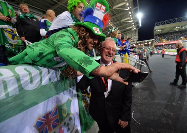 A Northern Ireland football team fan tries to get a selfie with the snooker legend 
Dennis Taylor. The official opening of the National Stadium this evening with a lap of former Northern Ireland legends pictured
Photo Colm Lenaghan/Pacemaker Press