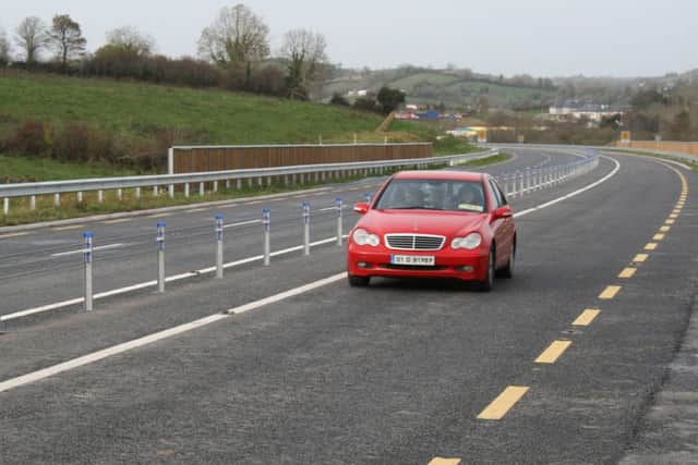 The Castleblayney bypass on the N2 route in Co Monaghan with its Two Plus One design, on the day it opened in late 2007. The oncoming car is in one of the single lane sections, in which it is not possible to overtake, but which is always followed by a two-lane section. By Ben Lowry