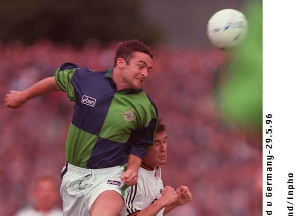 Michael Hughes
 in action against Germany in 1996