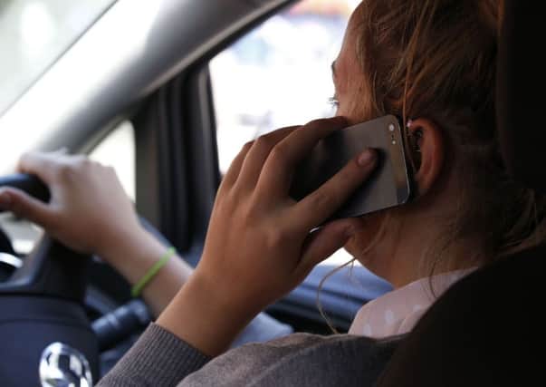Fines and penalty points for using a mobile while driving are to double on mainland GB