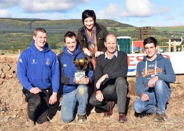 Left to right are the winners from the YFCU Soil Assessment Competition, James Purcell, Dungiven YFC (second place); Robert Smyth, Randalstown YFC (first place); YFCU President Roberta Simmons; Michael Creighton from sponsor of the competition Tesco and Richard Black, Lisnamurrican YFC (third place)