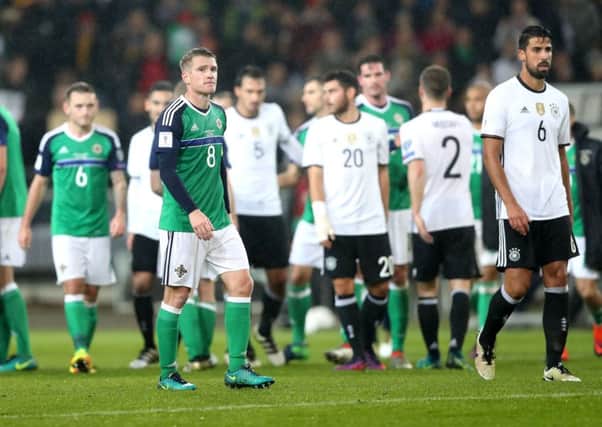 Northern Ireland's Steven Davis is dejected after being defeated 2-0 by Germany in Tuesday night's World Cup 2018 Qualifier at the HDI Arena in Hannover