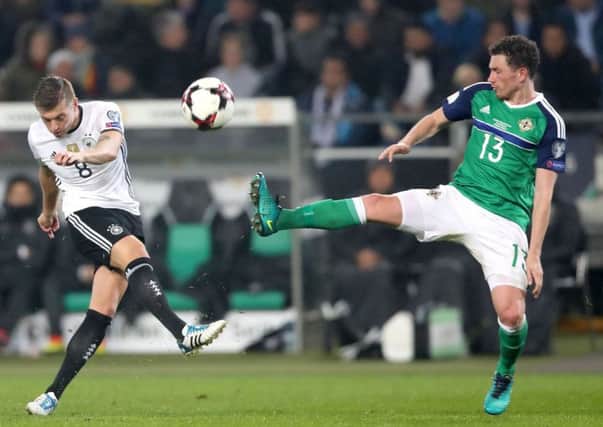 Germany's Toni Kroos with Northern Ireland's Corry Evans