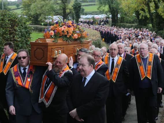 The coffin of high profile Orangeman Drew Nelson makes its way to St John's Church, Hillsborough.