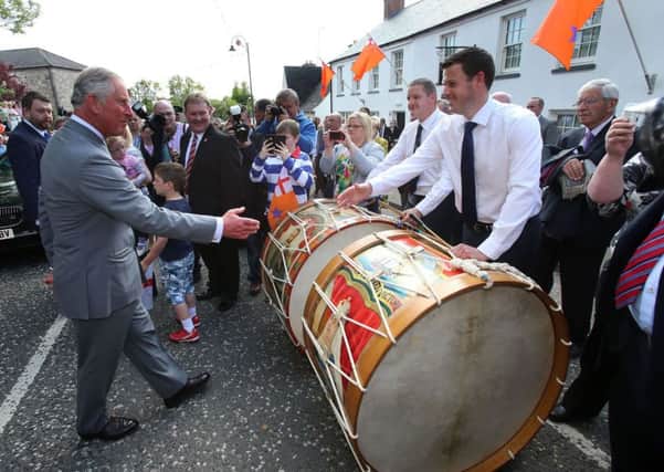 The Prince of Wales meets Lambeg drummers during a visit to the Orange Order heritage museum in Loughgall. Picture: Niall Carson/PA Wire