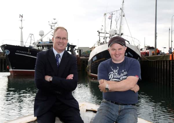Keith Thompson, left, of Ulster Bank and Bill Coffey in Portavogie with The Opportune, a half million pound investment that is expected to boost Mr Coffeys business by 33 percent.