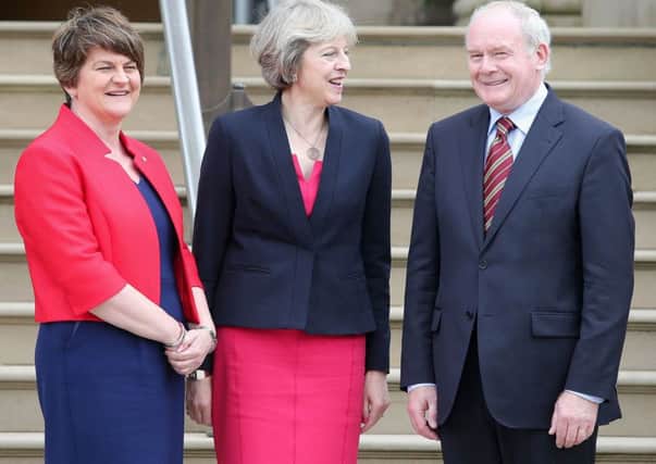 Prime Minister Theresa May pictured with First Minister Arlene Foster and deputy First Minister Martin McGuinness at Stormont Castle in July 2016, during her first official visit to Northern Ireland. Pic: Jonathan Porter  / Press Eye