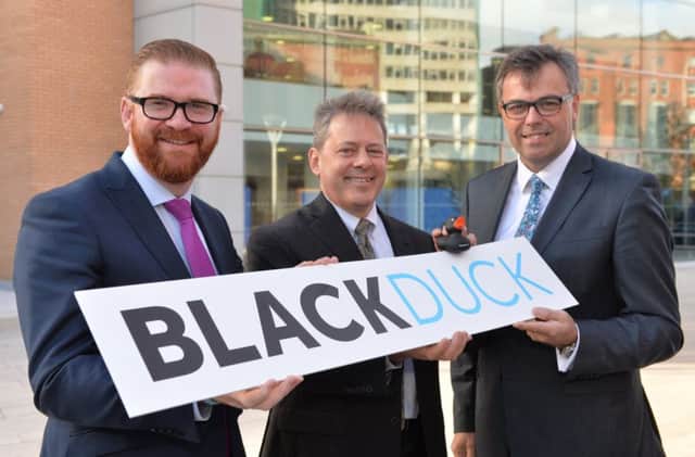 Economy Minister Simon Hamilton pictured with Black Duck president and CEO Lou Shipley, centre, with Invest Northern Ireland chief executive Alastair Hamilton at the jobs announcment in Belfast