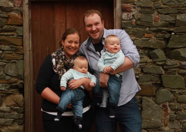 Proud parents Sarah and Sam Campbell, from Belfast, with their 'miracle babies' Harry and Benjamin