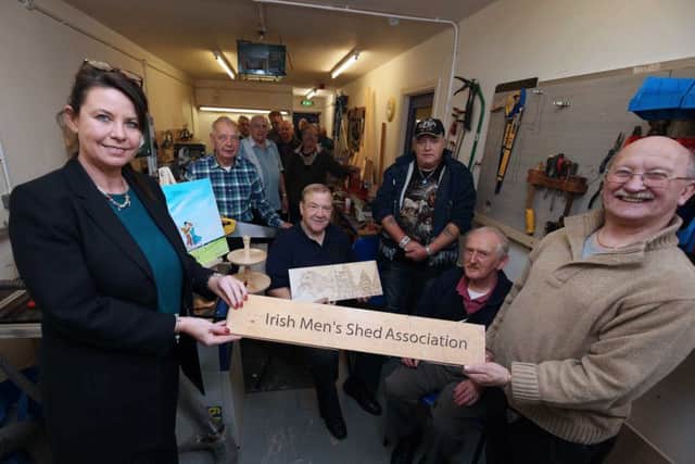 Members of North Belfast's Men Shed with Geraldine Nelson, project co-ordinator.