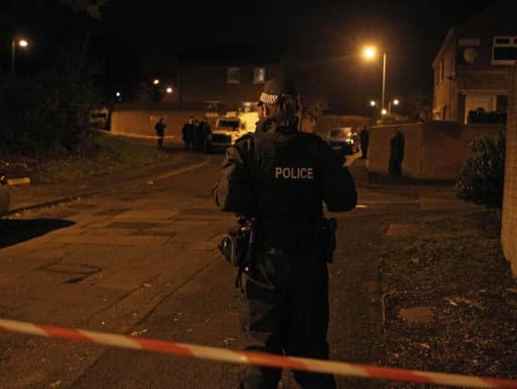 Police at the scene of the shooting in Poleglass