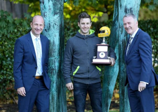 World Superbike champion Jonathan Rea pictured with Sam Geddis, Managing Director of Cornmarket Insurance Services and Stephen Watson, awards organiser.