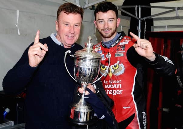 Alan Irwin celebrates his son Glenns victory in the Sunflower Trophy race on Saturday at Bishopscourt.